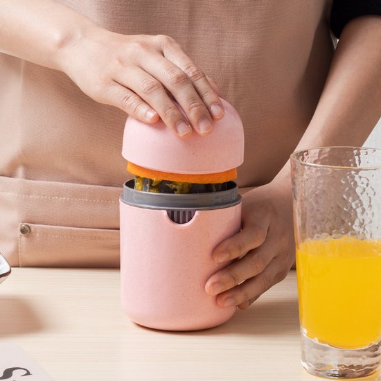 Rode sapbeker, handmatige sapcentrifuge, multifunctionele eenvoudige fruitjuicer, citruspers, mini-sinaasappelpers, citroenpers, granaatappelpers. van Merkloos
